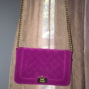 Pink purse with gold chain strap